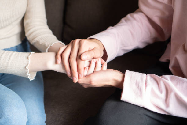 istock couple holding hands in an affectionate way 1414602647