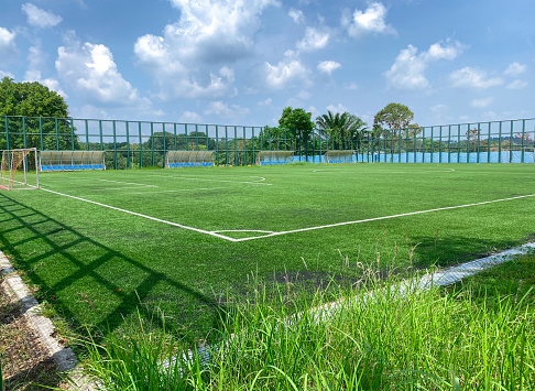 Super wide angle view of open spacious futsal field in HDB heartland in Singapore. Community football pitches in local neighbourhoods to encourage people to engage in active healthy lifestyle