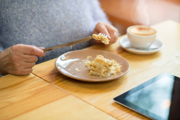 istock Hands and piece of cake. 1414604649