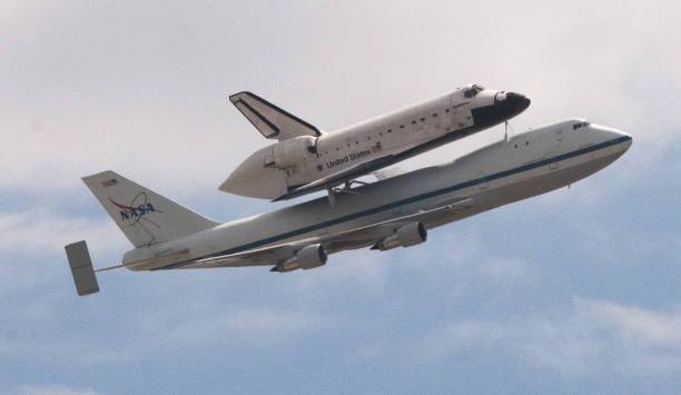 US Space Shuttle  Endeavour  flies on top of a NASA special 747 transporter, as it flies over The University of Arizona as a tribute to former Astronaut  Mark Kelly and his wife Congresswomen Gabrielle Giffords who was a victim of a mass shooting in Tucson.     Space Shuttle Endeavour was retired from NASA's Space Shuttle program, and sent to Samuel Oschin Pavilion at the California Science Center, located in Exposition Park in South Los Angeles . It embarked on its first mission, STS-49, in May 1992 and its 25th and final mission, STS-134, in May 2011.