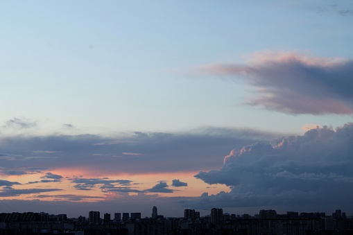 Colorful cloudy twilight beautiful sky cityscape sunset and morning sunrise. Dramatic evening night early morning view with city buildings silhouette. Panoramic background concept. Copy space for text