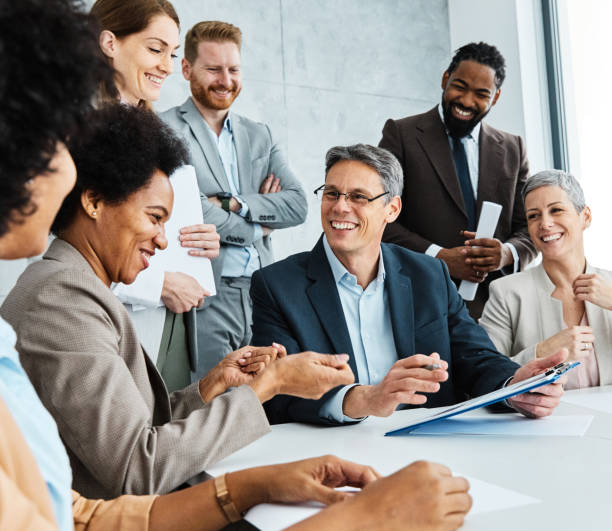 istock young business people meeting office teamwork group contract signing agreement document signature paperwork success corporate senior mature 1414606330
