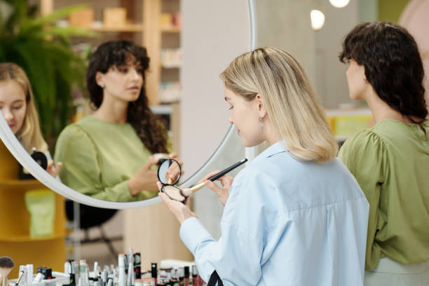 istock Young customer with brush and compact powder testing beauty products 1414606919