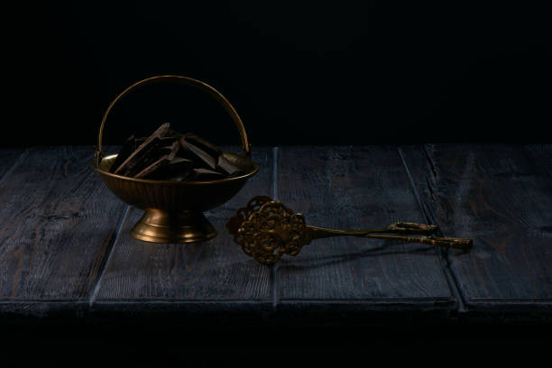 istock Dark chocolate in copper bowl on old wooden table 1414607344
