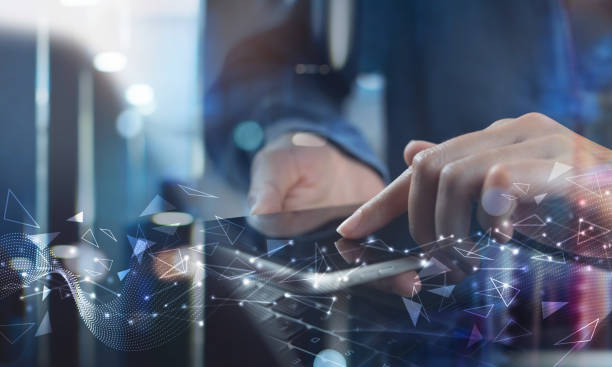 istock Digital technology, big data concept. Woman using mobile smart phone and laptop computer, abstract futuristic technology background 1414608189