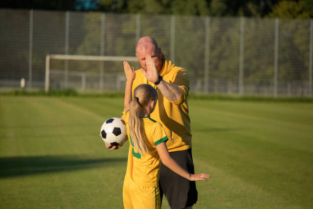 istock Soccer father and daughter working hard during a coaching session 1414608494