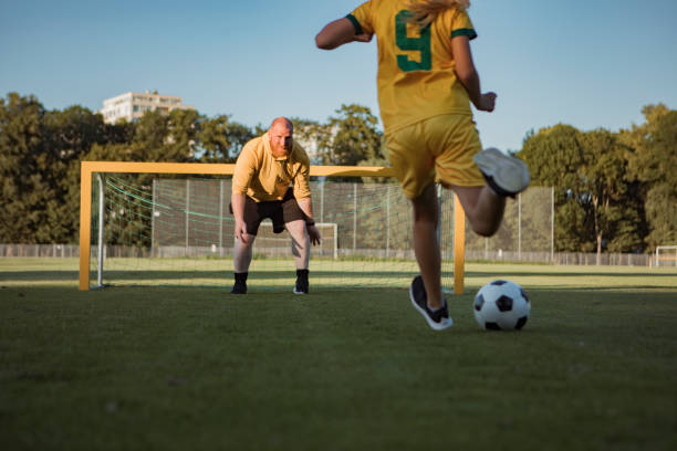istock Soccer father and daughter working hard during a coaching session 1414609115