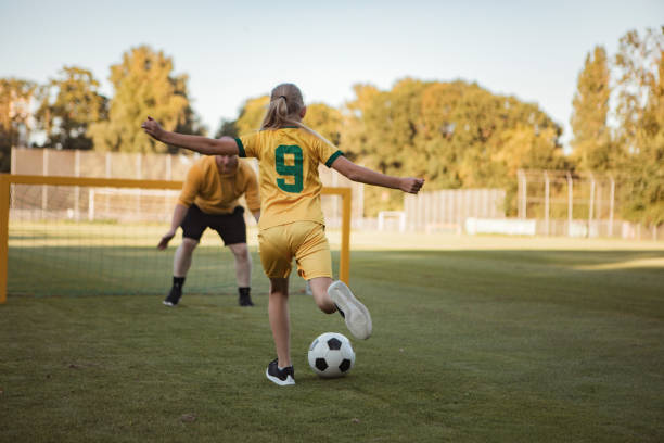 istock Soccer father and daughter working hard during a coaching session 1414609157