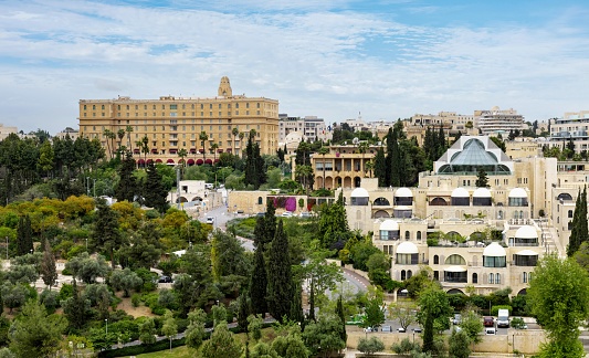 Jerusalem, Israel, May 2, 2019: View of the western Part of Jerusalem on a spring afternoon. In the background left is the Hotel King David and Hotel Jerusalem International YMCA (tower).