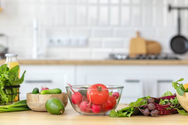 istock Kitchen table with various fresh vegetables for healthy and diet food with space for your product or text 1414609604