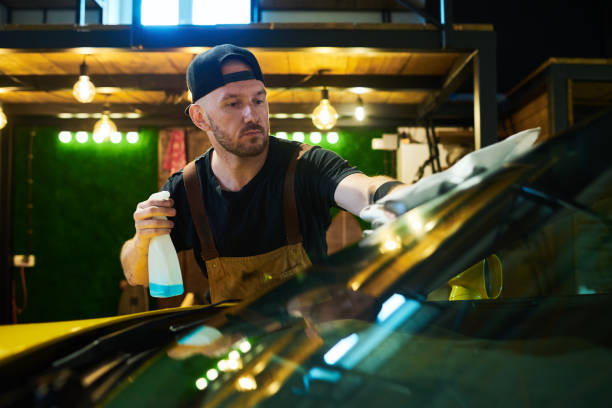 istock Young worker of maintenance service holding plastic bottle with sprayer 1414610789