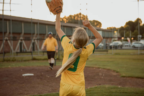 istock Baseball father and daughter working hard during a coaching session 1414610970