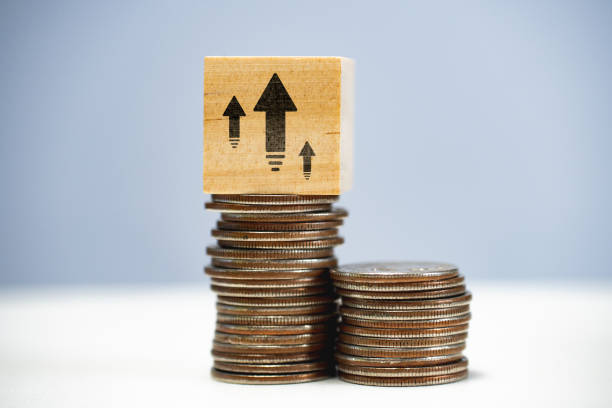 istock Capital growth concept. Increasing savings and capitalization. Stack of coins with up arrows. 1414611580