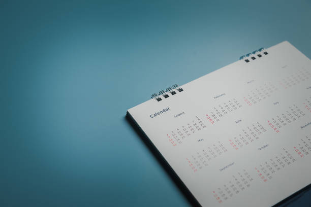 istock Embroidered red pins on a calendar event Planner calendar,clock to set timetable organize schedule,planning for business meeting or travel planning concept. 1414612700
