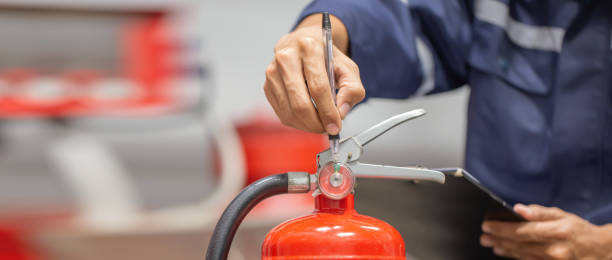 istock Engineer are checking and inspection a fire extinguishers tank in the fire control room for safety training and fire prevention. 1414612736