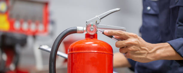 istock Engineer are checking and inspection a fire extinguishers tank in the fire control room for safety training and fire prevention. 1414612737