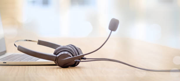istock Headset and customer support equipment at call center service. 1414612819