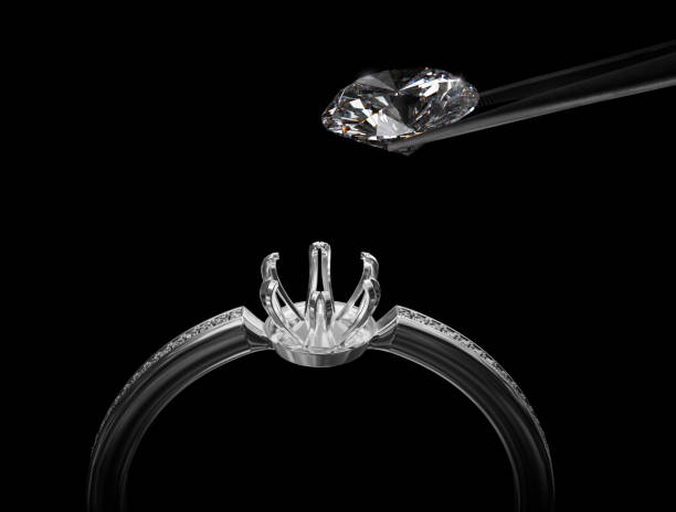 istock White gold or silver ring without gemstone and Excellent cut diamonds held by tweezers on a black background. 3d render 1414612896