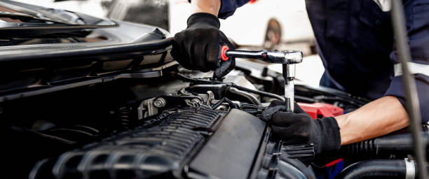 istock Car care maintenance and servicing, Close-up hand technician auto mechanic using the wrench to repairing change spare part car engine problem and insurance service support. 1414612939