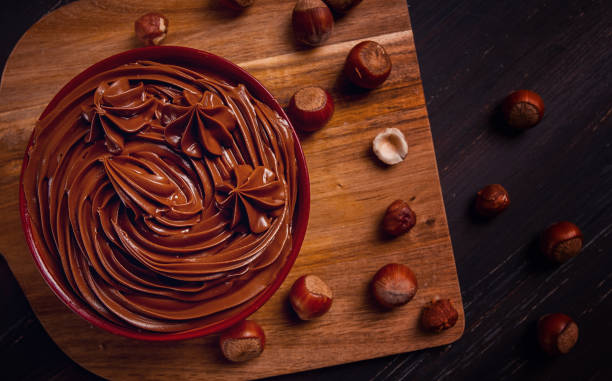 istock Chocolate nut paste, mousse, pasta, in a cup, on a wooden table, top view, selective focus, no people, 1414616147