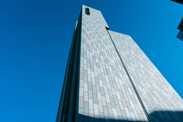 istock Buildings in Manchester city centre with blue sky brickwork backstreets 1414623028