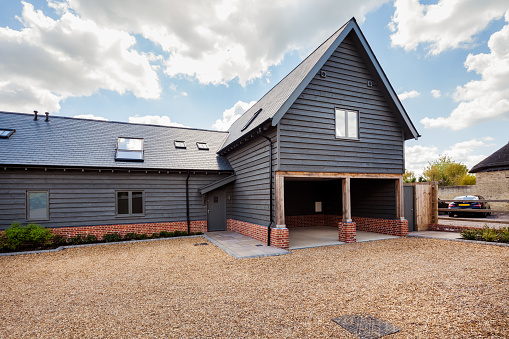 Swavesey, Cambridgeshire, England - May 21 2019: Front elevation of recently completed barn style home on new housing development,