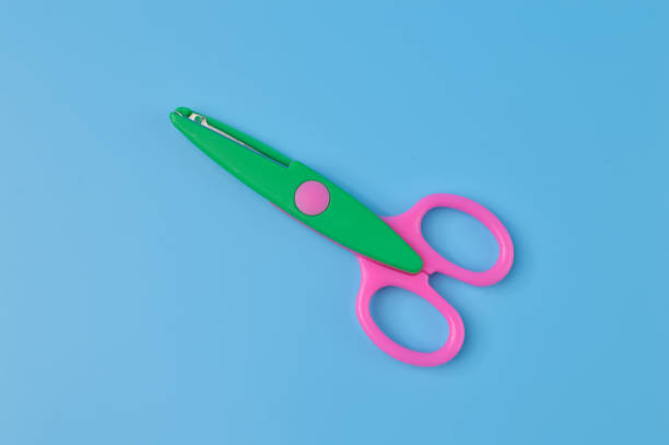Scissors isolated on a blue background. School and office supplies