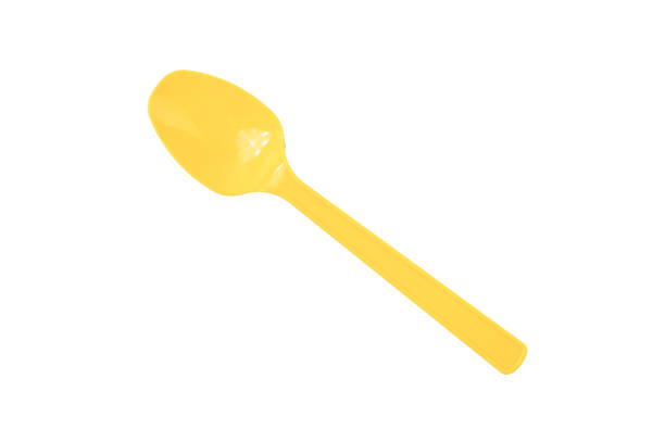 istock Yellow spoon isolated on a white background 1414626854