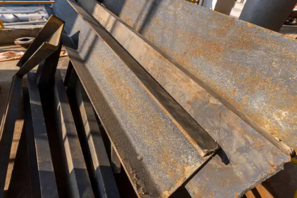 Photo of Scattered angle steel stacked on the construction site