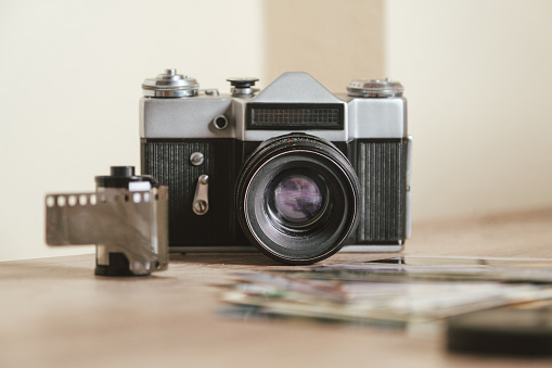 Retro film photo camera isolated on white background, old photo camera