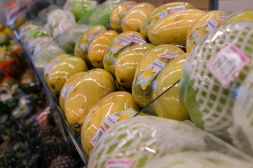 Singapore 2021 Fresh fruits individually wrapped in plastic and styrofoam nets for sale in supermarket. This common practice is considered to be wasteful and highly unsustainable