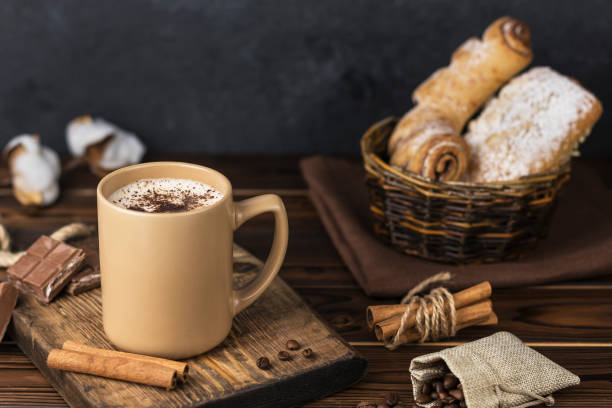 istock a cup of coffee with coffee beans on the table 1414631659