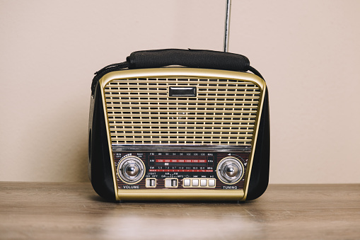 3d rendering of a brown rounded retro style radio receiver with an analogue tuner. Means of communication. Reaching audience. Radio shows.
