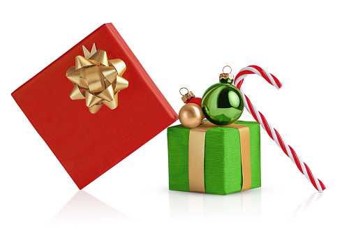 High angle view of Christmas gift boxes with ornaments on white background