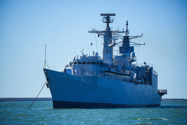 istock Warship sailing in still water 1414640169