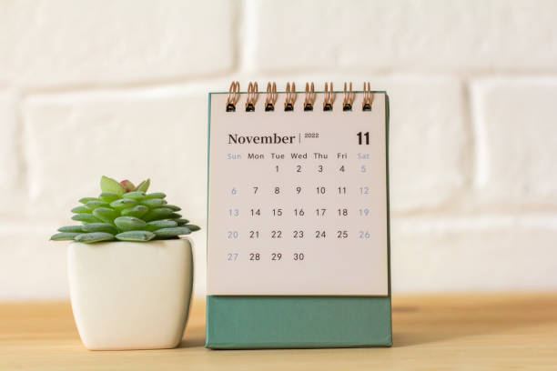 istock Desktop calendar for November 2022 on the table. 1414640340