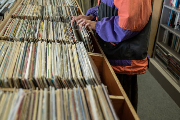 istock Woman seen searching through vinyl records 1414640385