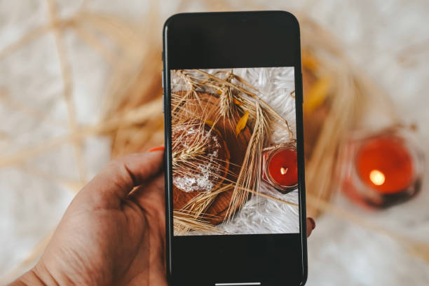 istock Taking photos of table with fresh baked bread 1414642608