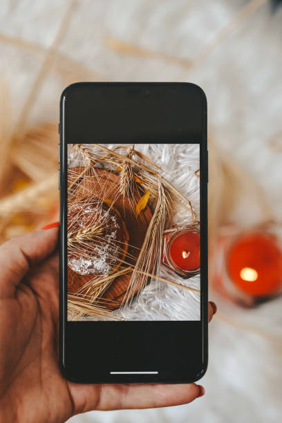 istock Taking photos of table with fresh baked bread 1414642611