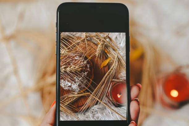istock Taking photos of table with fresh baked bread 1414642613