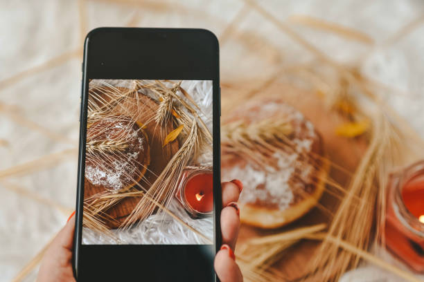 istock Taking photos of table with fresh baked bread 1414642626