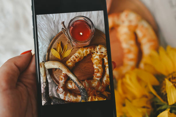 istock Taking photos of table with fresh baked bread 1414643874