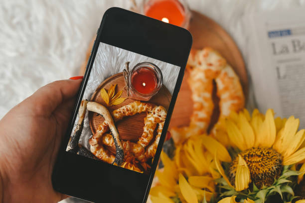 istock Taking photos of table with fresh baked bread 1414643889