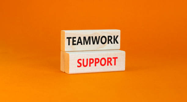 istock Teamwork support symbol. Concept words Teamwork support on wooden blocks on a beautiful orange table orange background. Business and teamwork support concept. Copy space. 1414645207