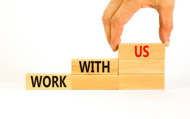 istock Work with us symbol. Concept words Work with us on wooden blocks on a beautiful white table white background. Businessman hand. Business, motivational and work with us concept. Copy space. 1414645216