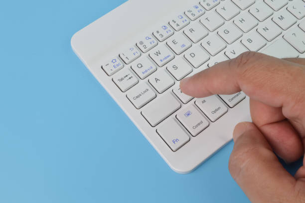 istock Hand pressing button on the laptop keyboard. Copy space for the text 1414648142