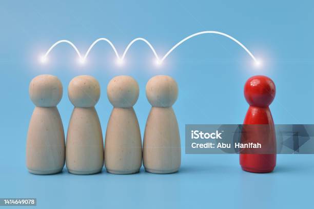 The Red Human Figure Is Connected By Lines With Four Peoples Business Management Leadership Teamwork Cooperation And Collaboration Concept Stock Photo - Download Image Now