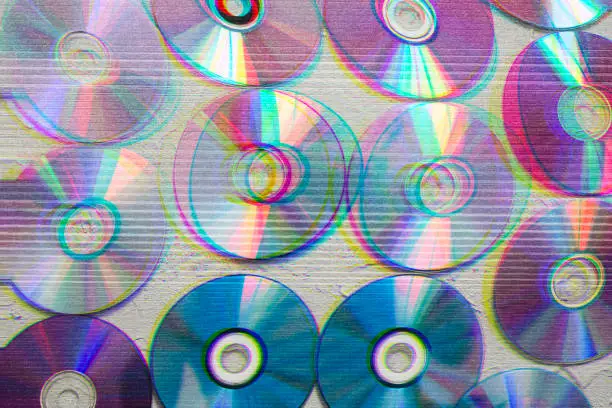 Photo of Image of cd's with glitch effect, retro wallpaper, futuristic, color effect.