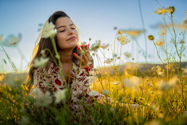 istock Young woman enjoys  summer afternoon and sunset 1414650329