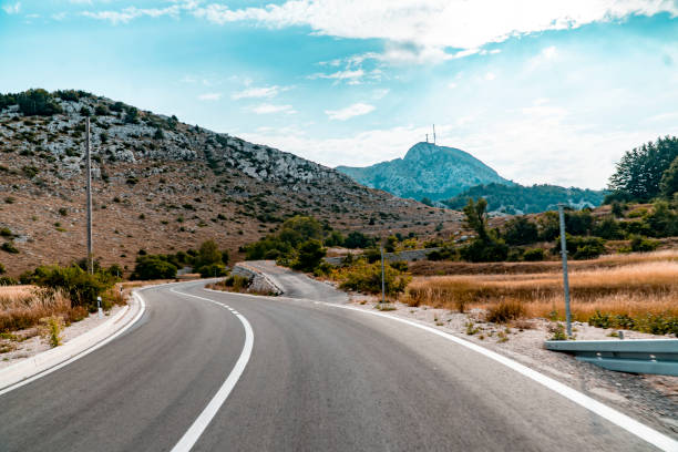 istock Image of highway with nature and mountains next to it 1414650699
